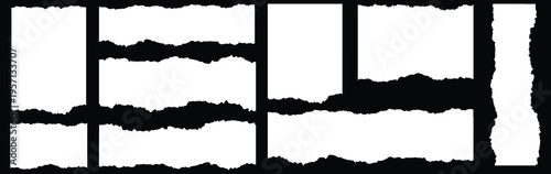 Collection of various irregular white paper strips isolated on a solid black background creating torn or ripped edge visual elements for design projects.