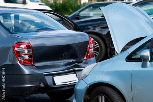 Photos Car accident in parking lot during day with damaged vehicles