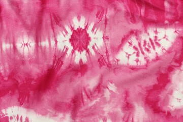 Pink and white tie dye fabric pattern background