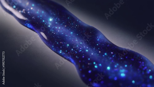 Blue galaxy liquid ribbon with glowing specks on silver