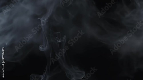 Wispy, ethereal white smoke billows and swirls against a deep black background