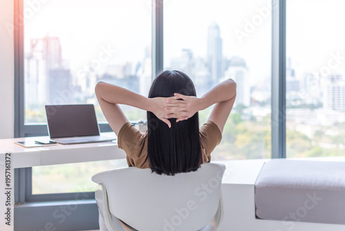 Work -life balance, living quality and carefree mental health concept with young woman take it easy resting in luxury business city hotel or at home office with computer pc laptop on lap