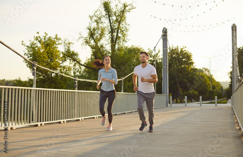 Bilde på lerret Morning jog of happy couple running together, active city walk and run of two young runners