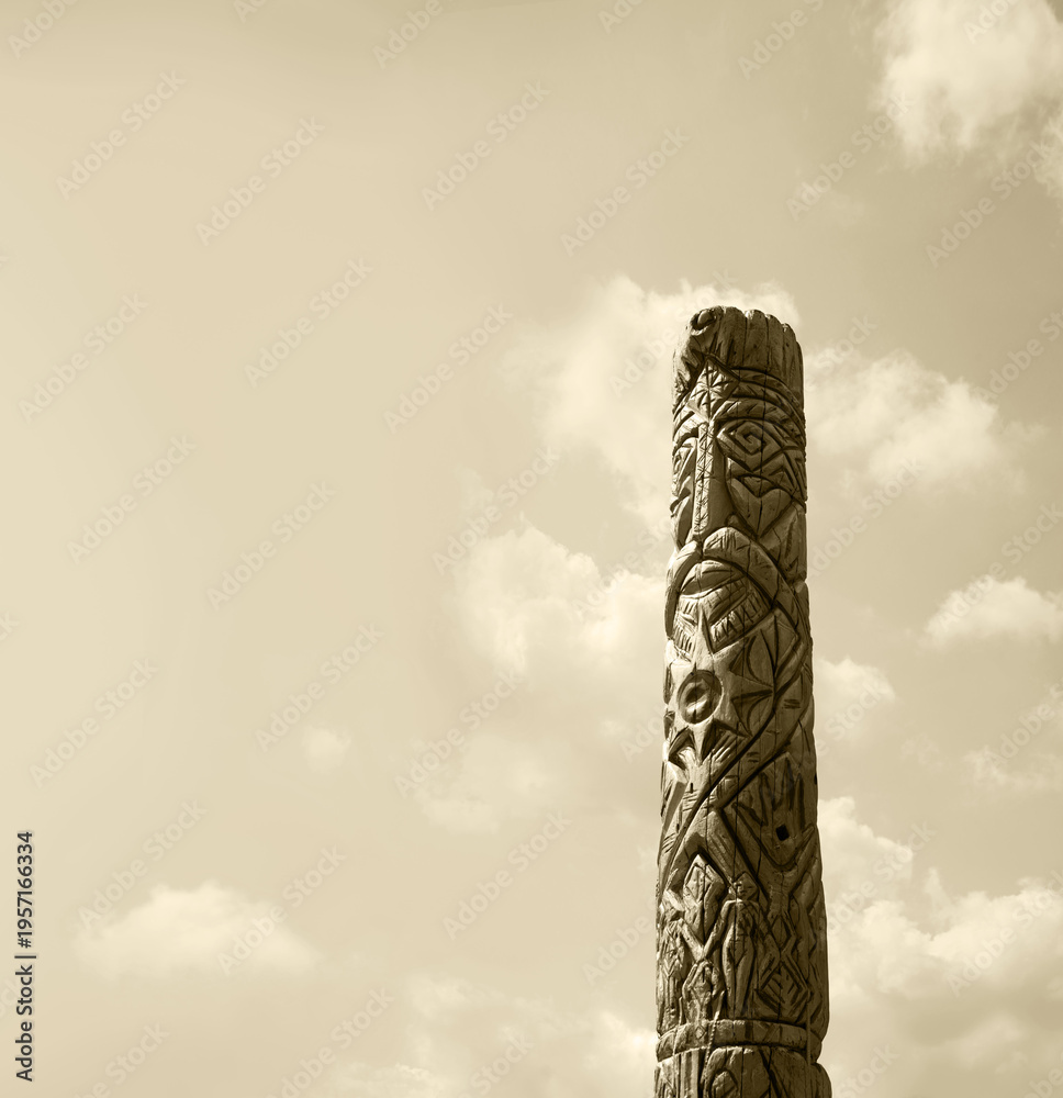 Fototapeta premium Old wooden idol in the field