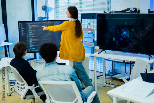 Diverse creative team of programmer develop ai assistant project together.Software engineer brainstorm about brain android robot,coding language,designer,artificial virtual intelligence with big data