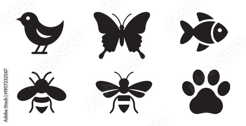 Diverse animal silhouette collection featuring bird butterfly fish bee and paw print on white background art