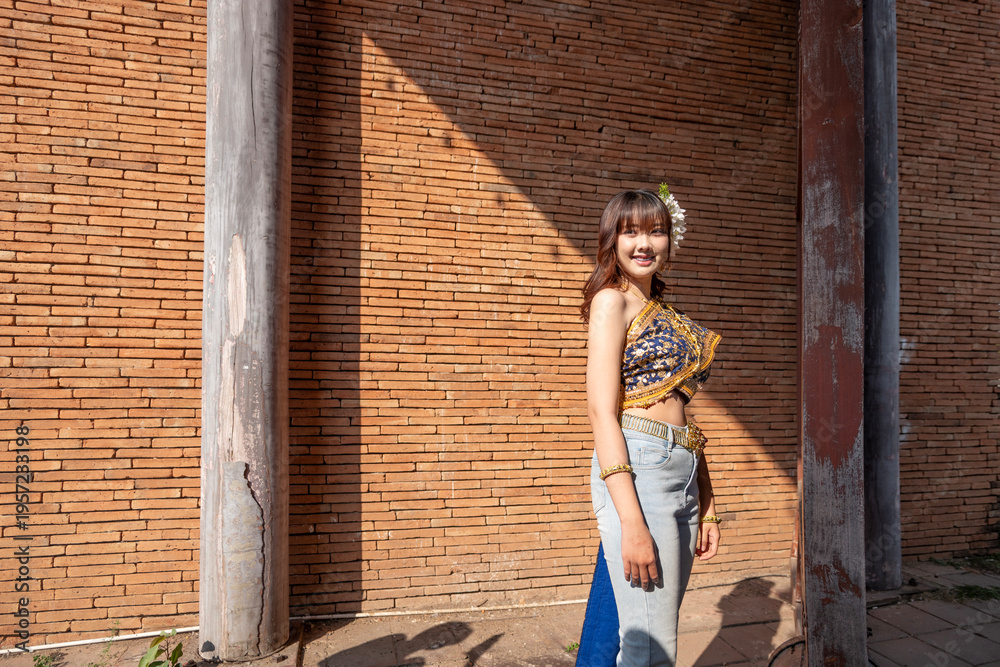 Fototapeta premium Beautiful young women wear Contemporary Thai dresses with jeans as a fashion trend in Chiang Mai.