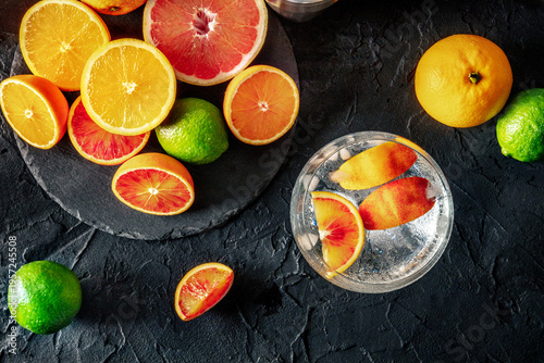 Wallpaper Mural Gin Tonic cocktail in a copa glass at a bar, with oranges, overhead flat lay Torontodigital.ca