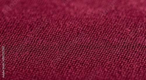 Close-up of red textured fabric surface with detailed weave patterns