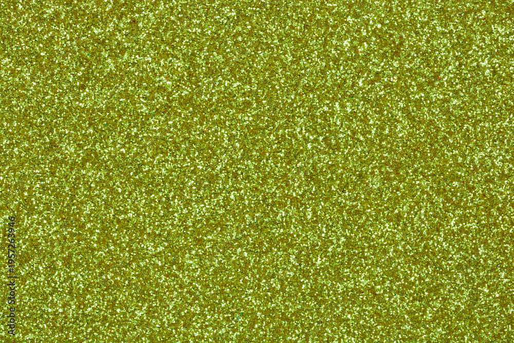 Obraz premium A dense shimmering light green glitter background with a fine sparkling texture and brilliant metallic reflections