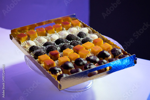Tray with an assortment of sweets and pastries offered during a wedding event