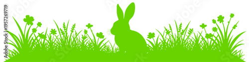 green easter bunny silhouette sitting in grass with wildflowers representing spring holiday nature freshness and seasonal celebration