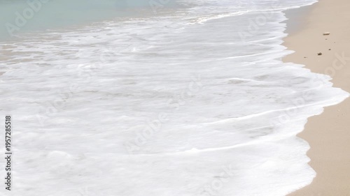 natural landscape sea beach sea water surface while sea waves is crashing on golden white sand beach splashing white bubble.seascape nature summer holiday background,summer beach south of thailand