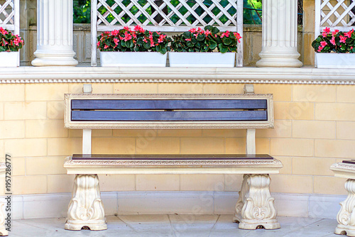 a stone bench for resting in the gazebo of the cultural city park