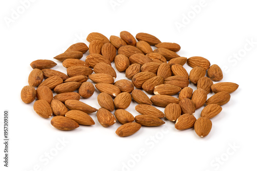 Quadro su tela Raw shelled almonds, scattered, isolated on white background