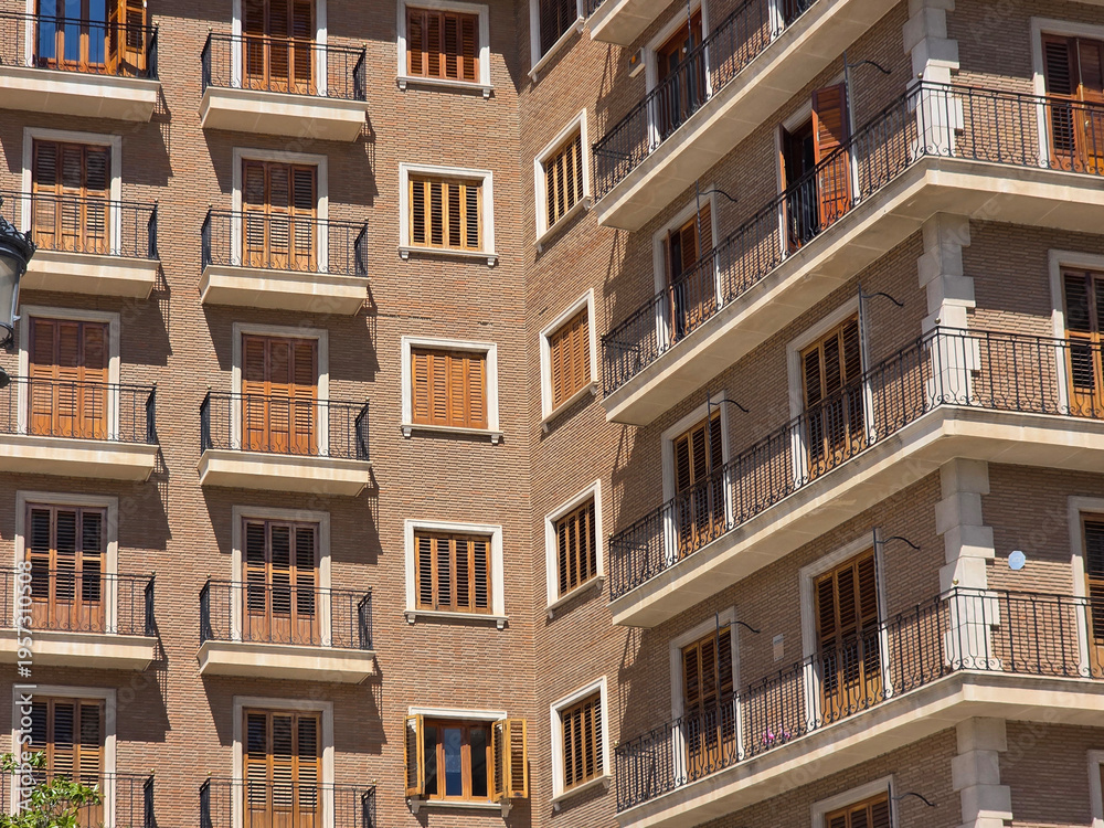 Obraz premium Residential apartment facade with balconies and windows in Valencia Spain