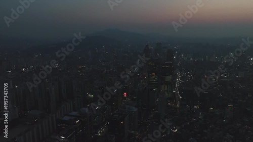 Aerial view of the glowing skyscrapers and busy city lights at night in Teheran-ro, Gangnam, Seoul, South Korea.