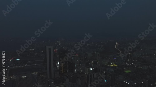 Aerial view of the glowing skyscrapers and busy city lights at night in Teheran-ro, Gangnam, Seoul, South Korea.