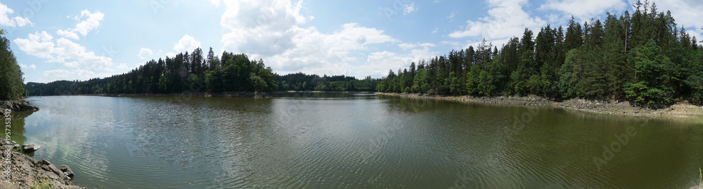 Fototapeta premium Ottenstein lake panorama in Niederösterreich with calm water and surrounding nature, clear summer day in Austria