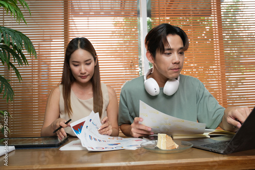 A young Asian couple spend time together at home