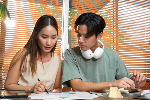 A young Asian couple spend time together at home