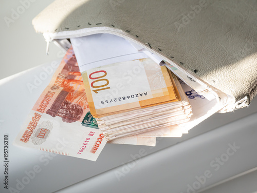 Stack of Russian ruble banknotes inside a leather wallet. Money cash savings and personal finance concept. Banking, investment, payment, and wealth accumulation. Financial economy budget.