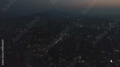 Aerial view of the glowing skyscrapers and busy city lights at night in Teheran-ro, Gangnam, Seoul, South Korea.