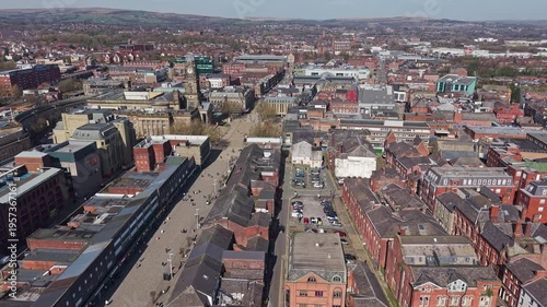 BOLTON, GREATER MANCHESTER, ENGLAND - MARCH 18, 2026: Drone view looking down over Newport Street and Bolton town centre, slow approach