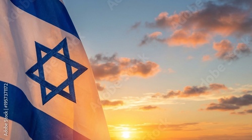 The vibrant Israeli flag proudly unfurls its blue and white against a beautiful, warm golden sunset sky.