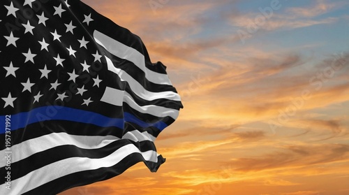 Thin blue line american flag proudly waves against a breathtaking golden orange sunset sky, symbolizing support for law enforcement officers.