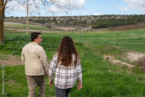 Children exploring nature in a green field landscape