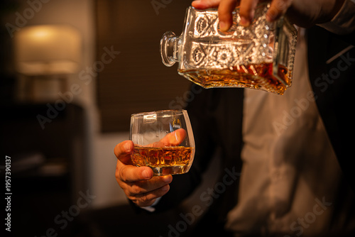 Closeup businessmen holding a glass of whiskey