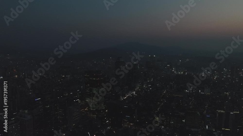 Aerial view of the glowing skyscrapers and busy city lights at night in Teheran-ro, Gangnam, Seoul, South Korea.
