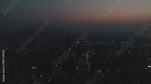 Aerial view of the glowing skyscrapers and busy city lights at night in Teheran-ro, Gangnam, Seoul, South Korea.