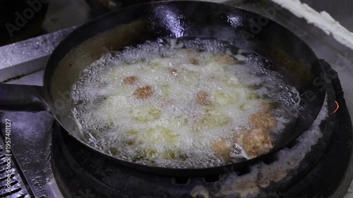 The process of making traditional fried meatballs on-site in the kitchen