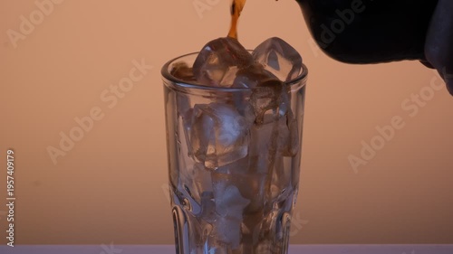ice and cola in a glass
