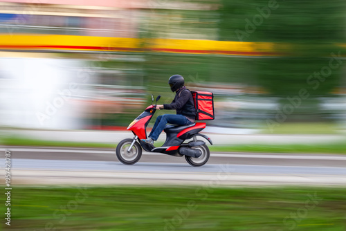 Online shopping and food delivery, technology and lifestyle, A courier on his way on a scooter.