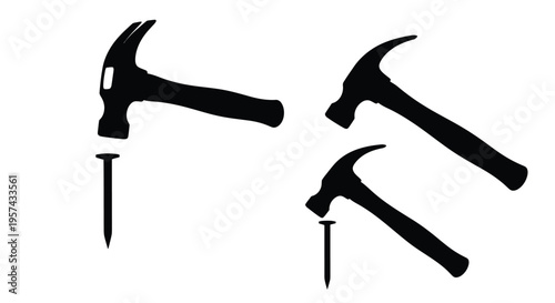 Black hammer and nail tools displayed in a stark silhouette