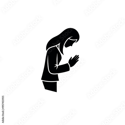 Silhouette of a woman praying showing devotion and spirituality.