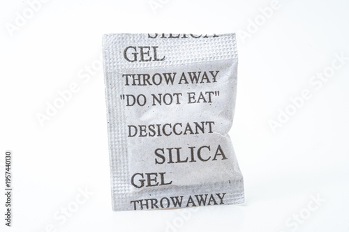 Silica gel desiccant packet with “Do Not Eat” warning isolated on white background for moisture control.