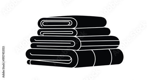 A stack of neatly folded black towels presented in a minimalist style