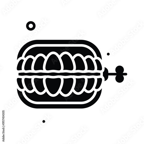 A captivating glyph icon of wind up denture prank toy