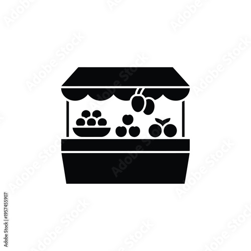 Simple black silhouette of a fruit stand displaying apples and grapes