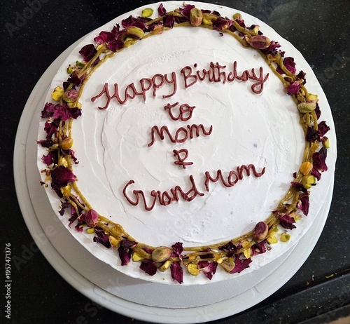 Wallpaper Mural A birthday cake decorated with white frosting and topped with edible pistachios and dried rose petals Torontodigital.ca