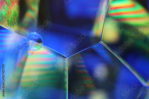 Abstract macro of hexagonal soap bubble structures with colorful light interference