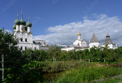 Metropolitan Garden with pond and apple trees and the Church of St. Gregory the Theologian of the 17th century in the Kremlin in Rostov the Great
