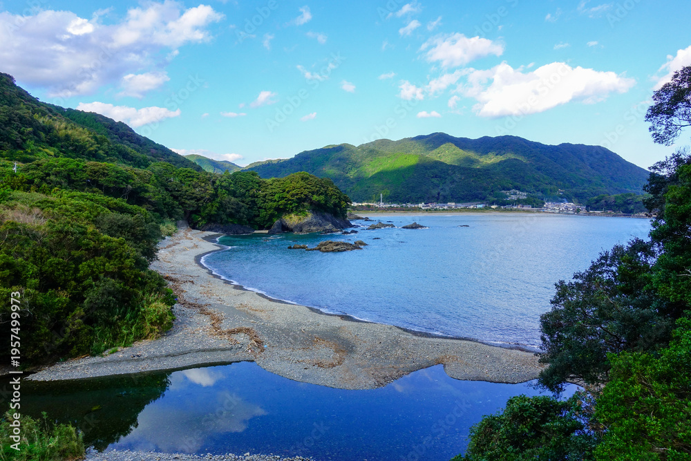 Fototapeta premium Scenic coastal bay with river estuary and forested mountains along Shikoku Henro pilgrimage route in Japan
