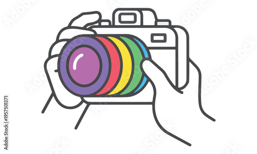 Hands holding camera with rainbow lens isolated on white