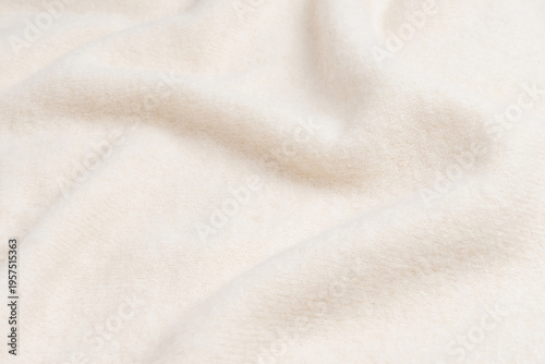 Beige sweater texture as a background.