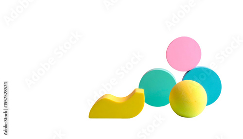Colorful shapes isolated on black, including circles, a sphere, and a curved slice